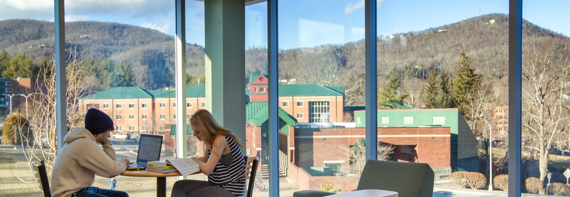 Students studying with howard's knob in the background