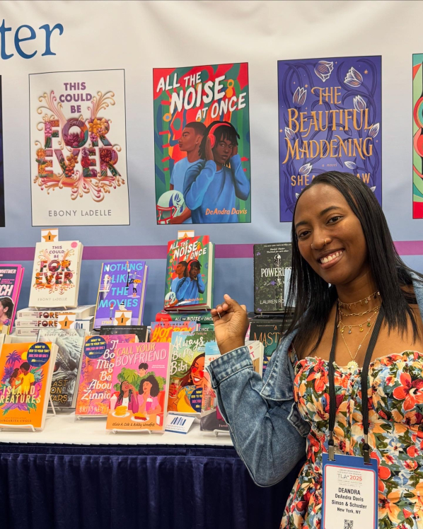 Photo of DeAndra Miller and her book