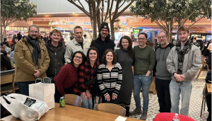 Photo of students and faculty in NYC posing with Kayla Rae Whitaker